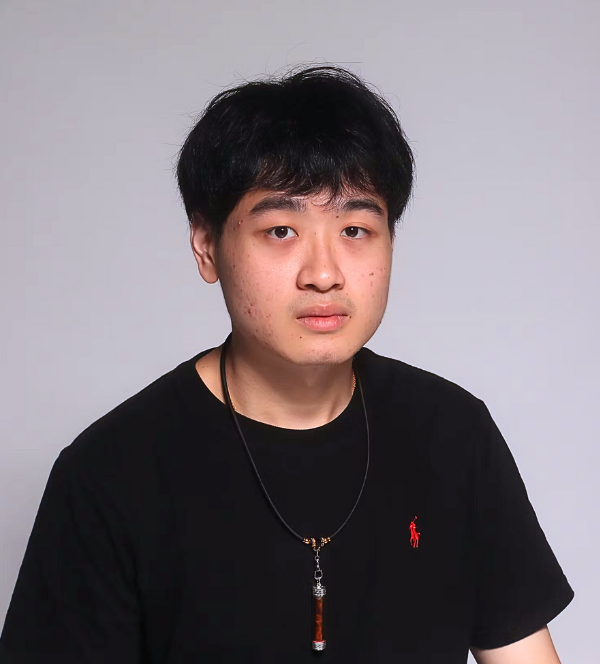 A professional headshot of Alger Goh